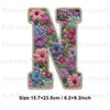 Iron-on patch of the letter N decorated with colorful floral embroidery