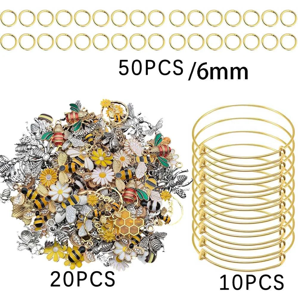 A collection of 50 pieces of silver-tone jewelry components, including bangles and charms, packaged for crafting.