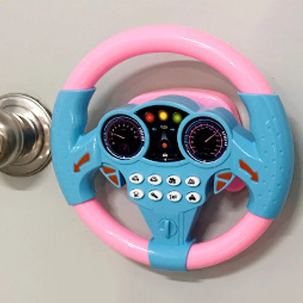 A pink and blue educational steering wheel with buttons and gauges for toddlers.