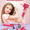 A pink hair styling set for children includes a hairdryer, combs, scissors, and brushes displayed in a playhouse setting.