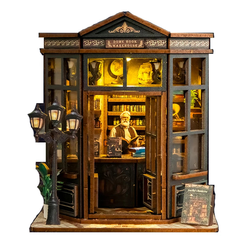 A wooden diorama kit of a bookstore book nook featuring shelves, a desk, and an illuminated display.
