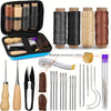 A leather sewing and repair kit showing waxed thread spools, needles, and various tools for crafting.