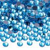 A pile of bright blue glass crystal hot fix rhinestones for DIY crafts and decor