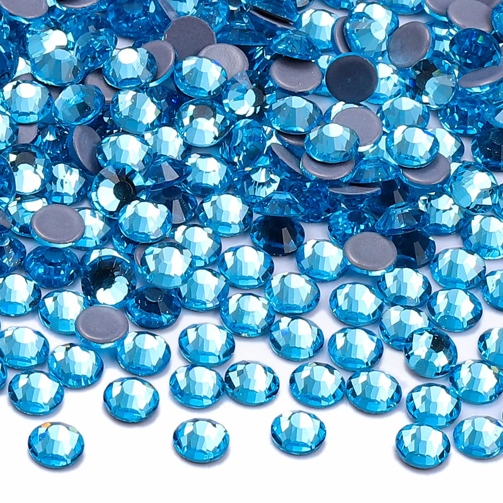 A pile of bright blue glass crystal hot fix rhinestones for DIY crafts and decor