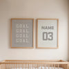 Framed wall art featuring the words GOAL GOAL GOAL GOAL and the number 03 on a light beige wall.