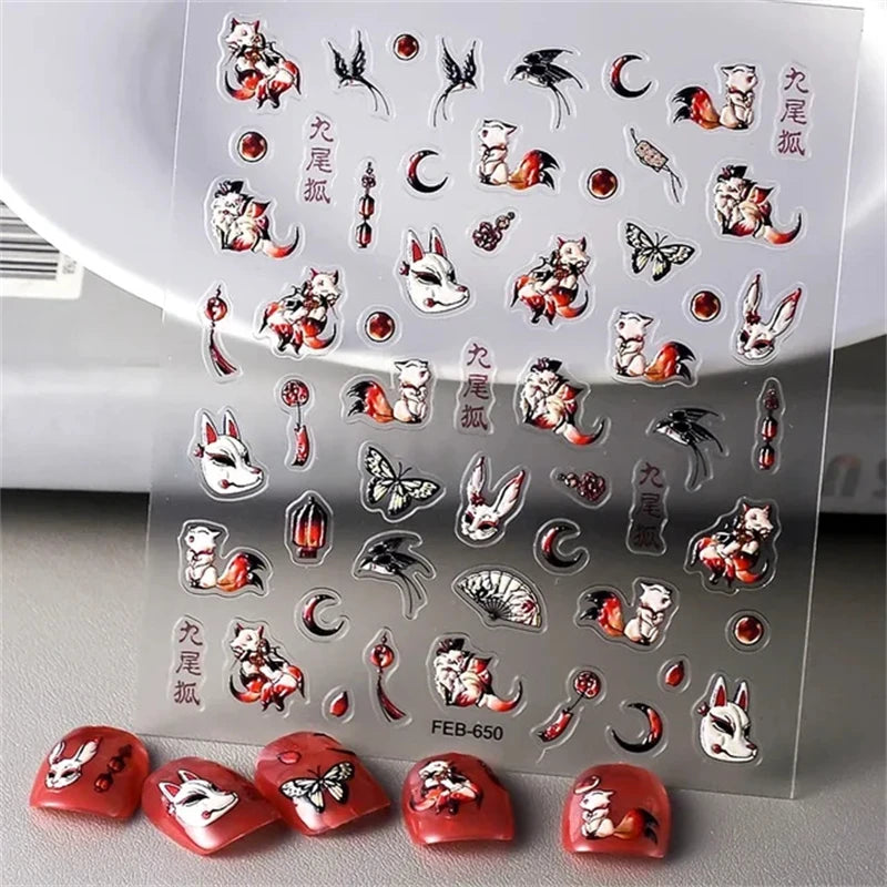 A sheet of 5D bronzing gothic nail art stickers featuring cats and celestial designs, with several red nail tips displayed be
