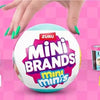 A collection of various mini brands and collectibles displayed around a large Zuru Mini Brands ball.