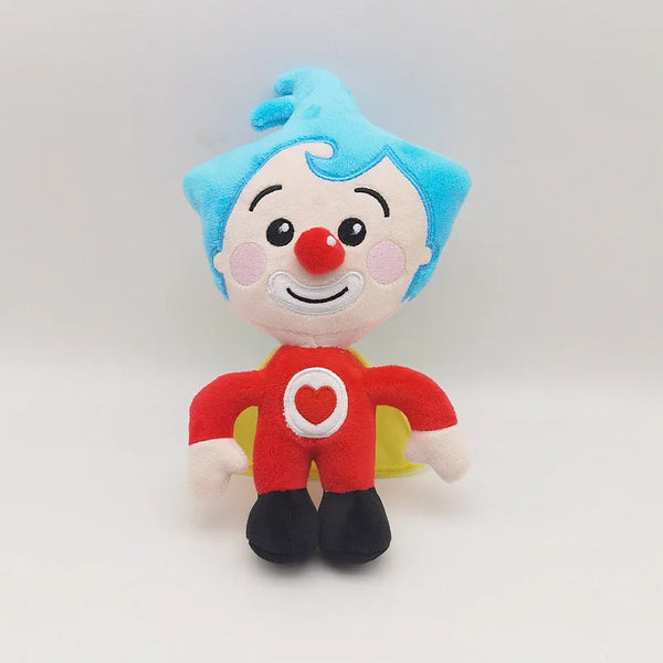 A plush toy of a smiling clown with blue hair, a red nose, and a red shirt with a white heart.