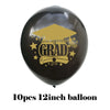 A black balloon decorated with gold text reading Congrats GRAD and stars, used for graduation party decor.