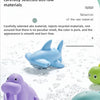 A collection of plastic turtle bath toys in various colors, including blue and purple, resting on a surface.