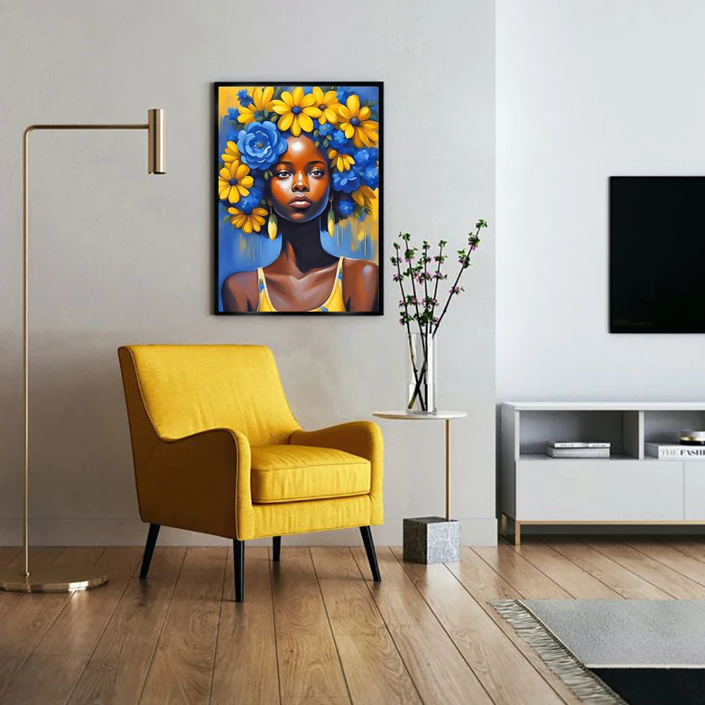A vibrant painting of an African woman with blue and yellow flowers, displayed in a modern living room setting.