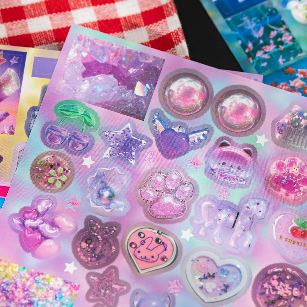 A collection of iridescent and glittery die-cut stickers featuring cute characters, stars, and cosmic themes.