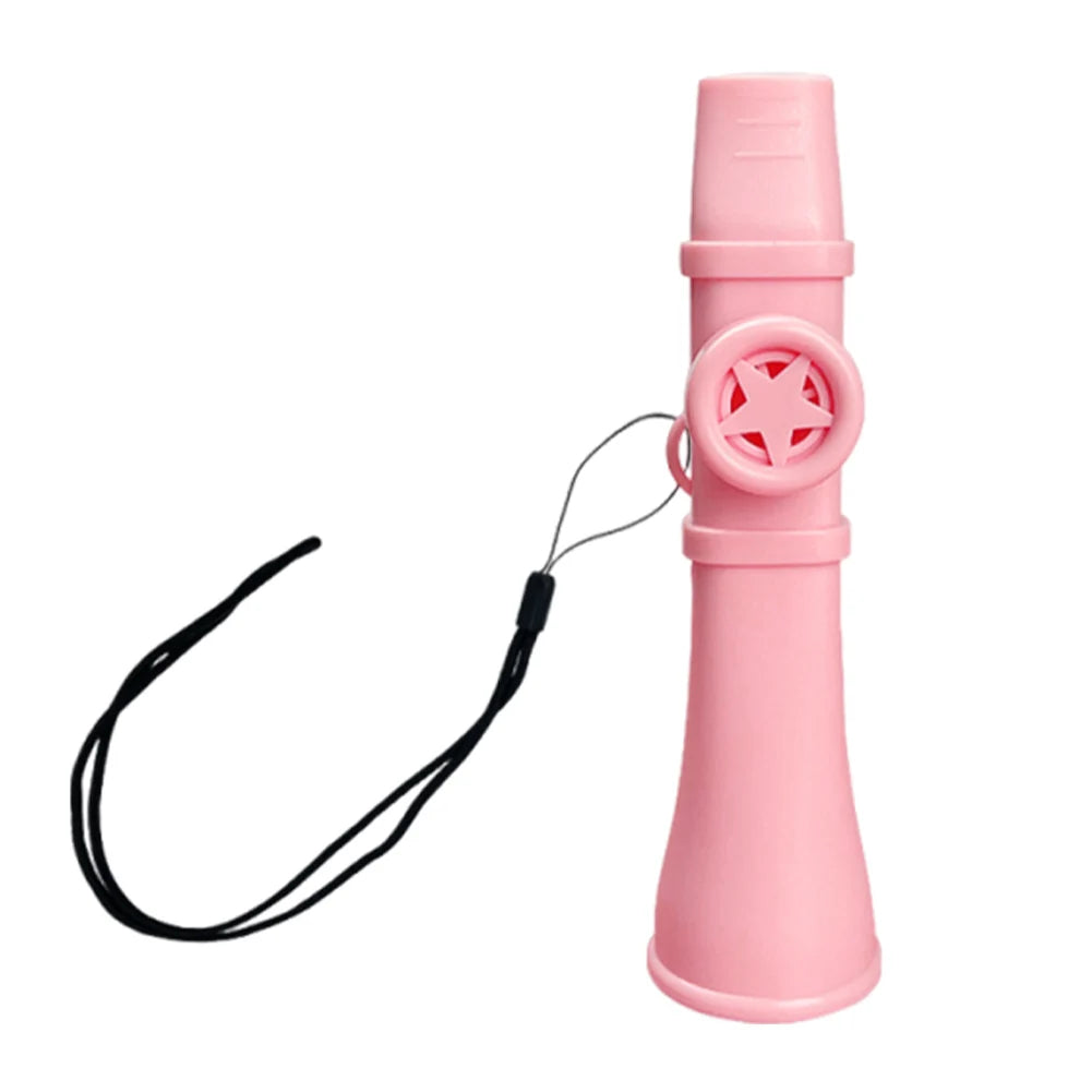 A pink portable kazoo flute with a lanyard attached, shown from the side.