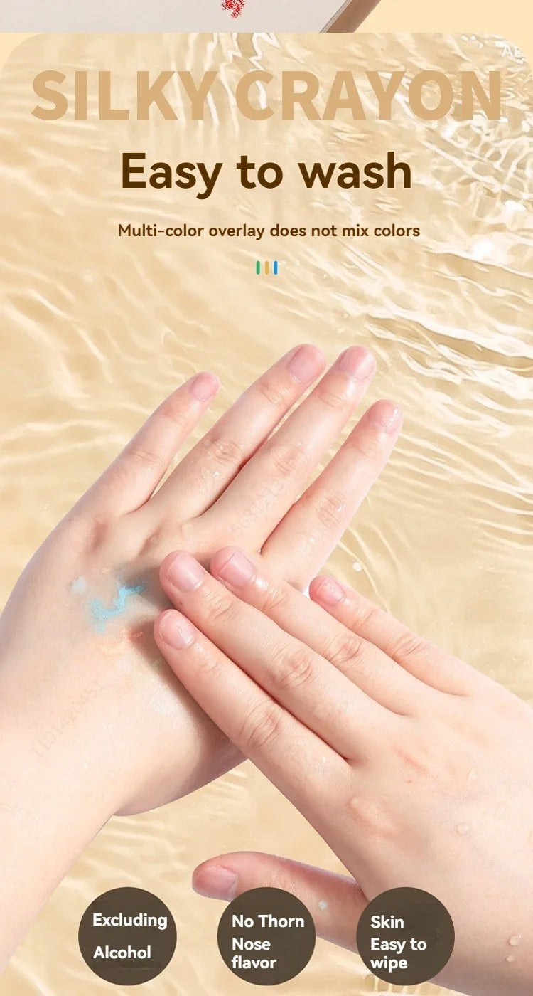 Hands showing silky crayon on skin with text about easy washing and non-mixing colors