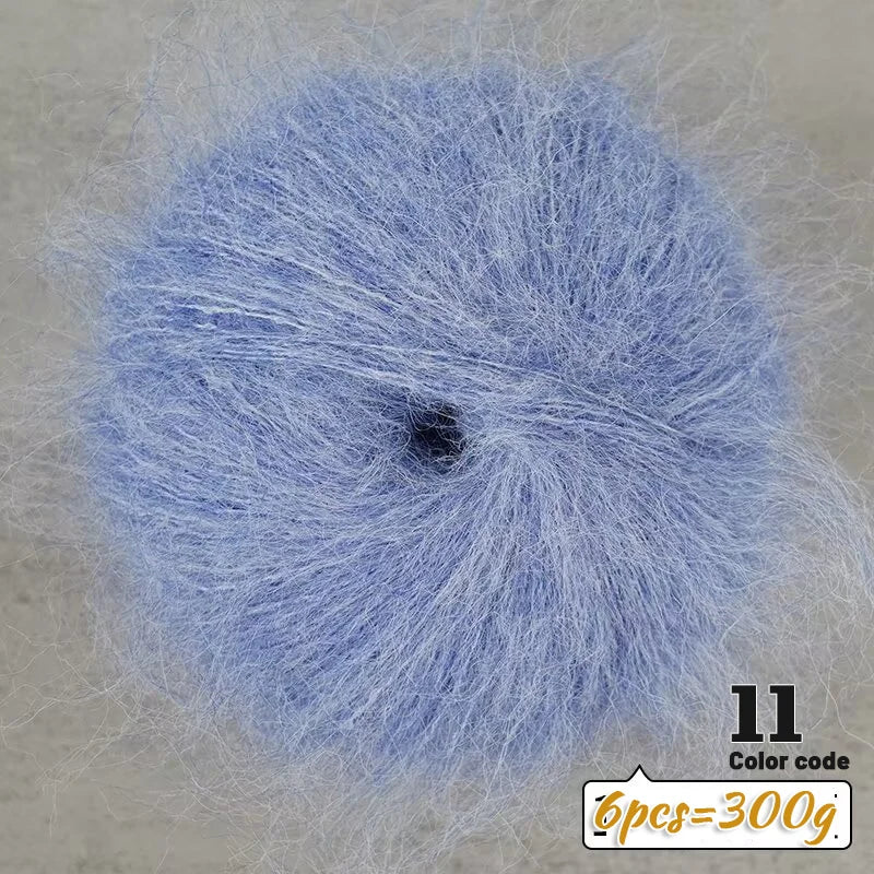 A ball of light blue long-haired alpaca blend yarn with a label indicating 11 color code and 6 pieces equal to 300g.