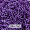 A close-up of deep purple raffia paper shreds used for gift boxes and baskets.