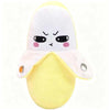 A yellow fruit plush toy with a white body and angry facial expression.