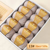 Box of Merino wool yarn balls with labels indicating 13# weight, totaling 10 pieces and 500g.