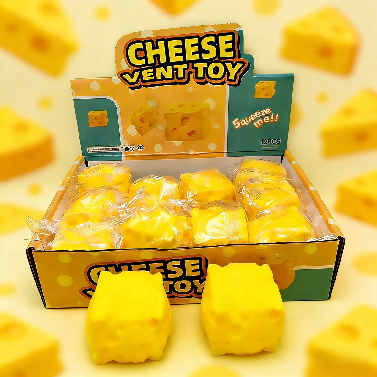 A box of yellow cheese squeeze fidget toys with several yellow squishy toys displayed on the surface.