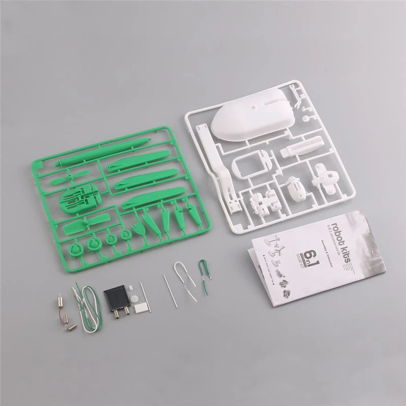 A green and white 6-in-1 DIY solar robot kit for kids showing various tools and components.