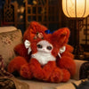 An adorable orange and white fox plush collectible with large eyes sitting on a textured surface.