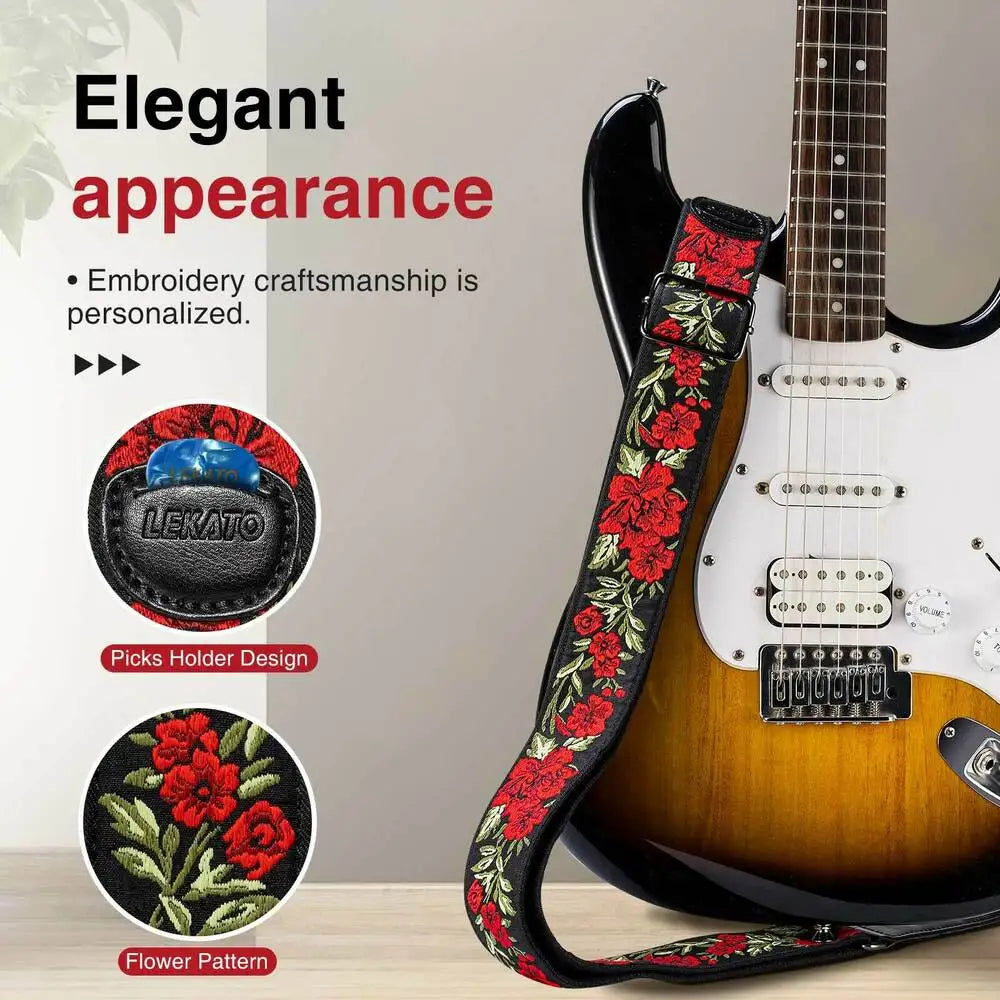 A close-up of a vintage floral guitar strap featuring embroidery craftsmanship and a picks holder design.