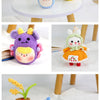 A collection of soft chenille yarn stuffed into various cute animal shapes like a purple dragon and a yellow elephant.