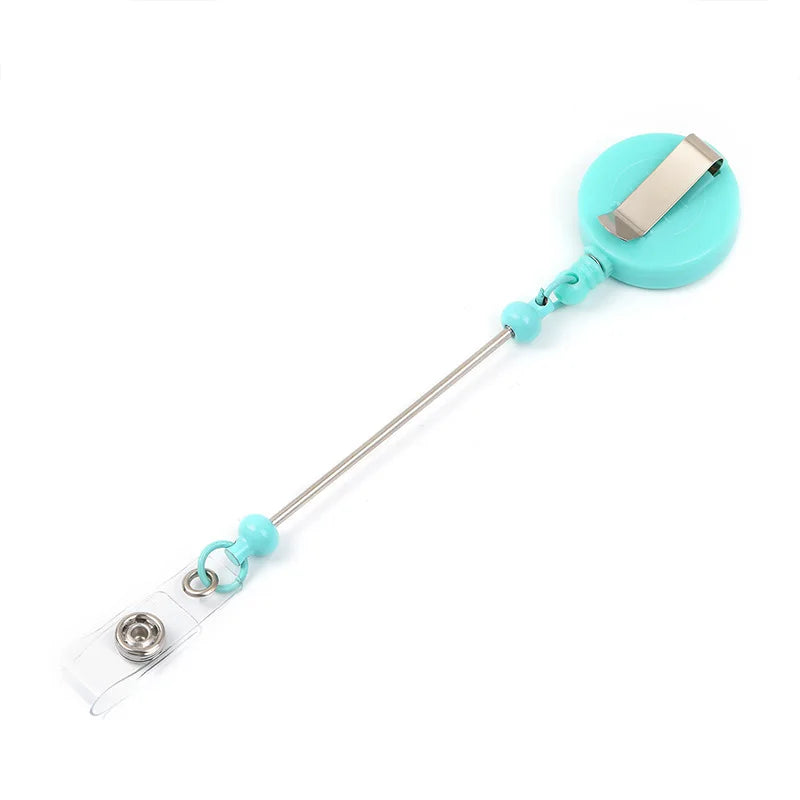 A beadable badge reel with a silver clip and a light blue plastic body.