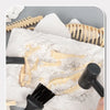 A white plaster block with fossil-like impressions and clay-like material is shown alongside tools for a dinosaur fossil dig 