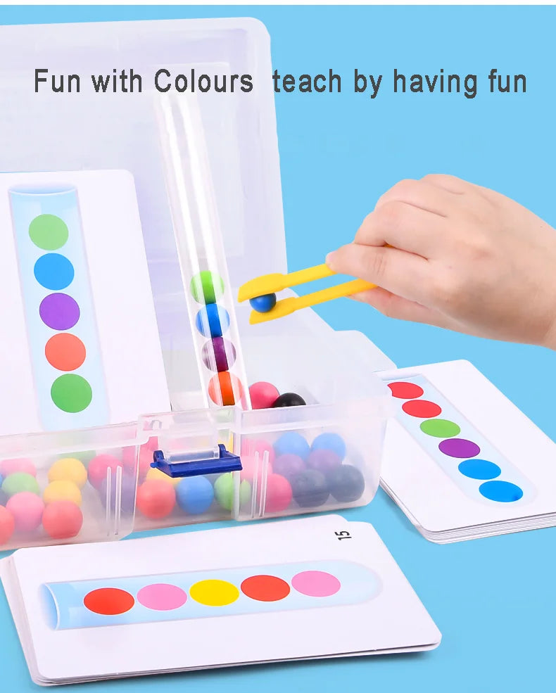 A hand is using yellow wooden clips to move colored beads in a clear plastic Montessori game box.