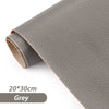 Roll of grey self-adhesive PU leather repair patches for fabric and bags