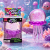 A purple Jelly Squish toy is displayed on a surface with colorful sensory elements and blurred background objects.