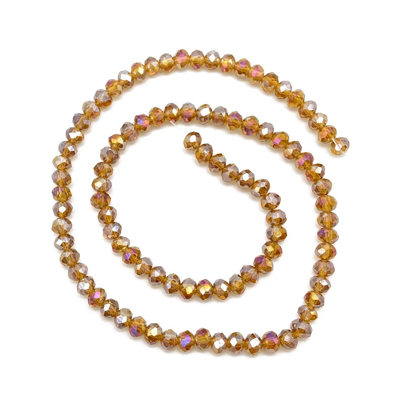 A strand of golden amber crystal beads used for jewelry making.