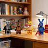 A collection of Five Nights at Freddy's Bonnie and friends mini building block figures displayed on a wooden shelf.