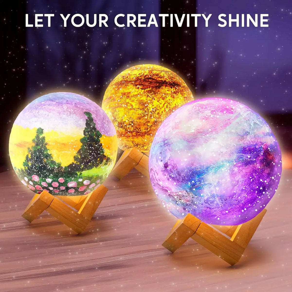 A craft kit featuring three glowing, spherical moon night lights with vibrant colors on a wooden surface.