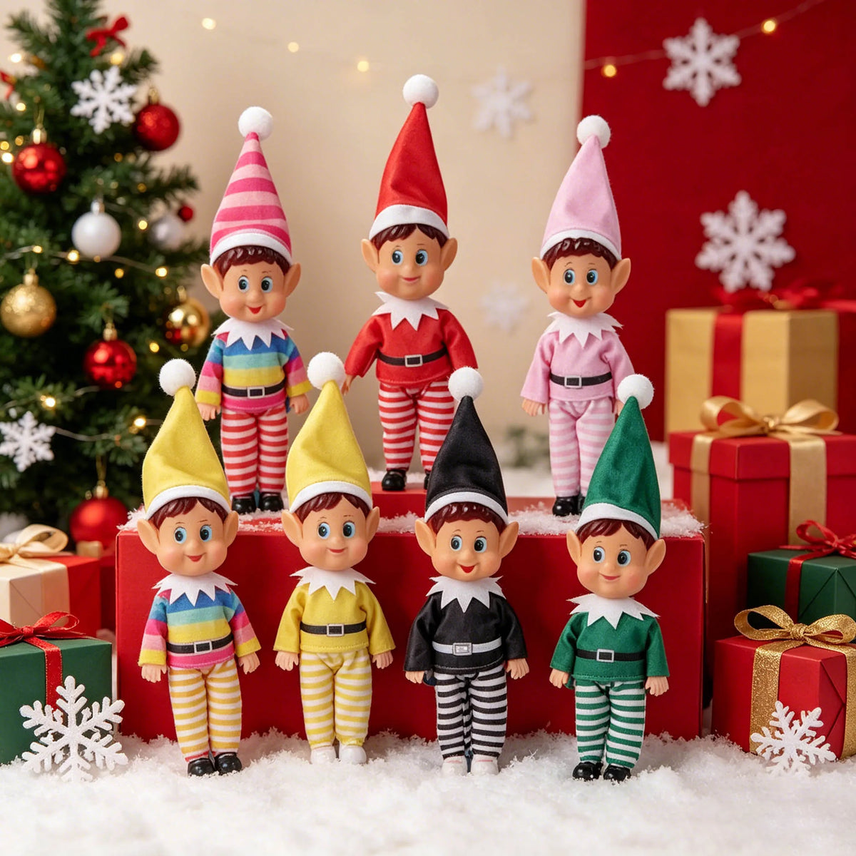 A set of seven elf figurines in various holiday outfits standing on a white surface with Christmas decorations.