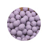 A circular arrangement of small, purple silicone beads in various sizes for DIY jewelry making.