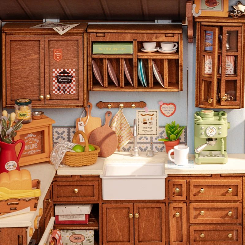 A miniature dollhouse kit featuring a cozy baking kitchen with wooden cabinets and accessories.
