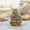 A stack of natural microporous aquarium stone for planted tanks, showing layered, textured rock.