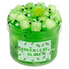 A jar of green leaf slime with clear jelly pieces, black beads, and lime slices.