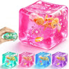 A collection of translucent squishy stress balls in various colors including pink, green, and blue, with some featuring glitt