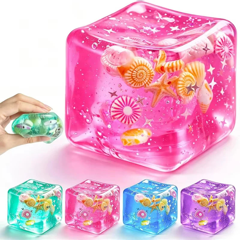 A collection of translucent squishy stress balls in various colors including pink, green, and blue, with some featuring glitt