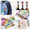 A collection of festive Christmas silicone beads and jewelry making tools including beads, tools, and a pink fabric pouch.