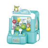 A green and white mini claw machine toy for kids with a clear plastic display box.