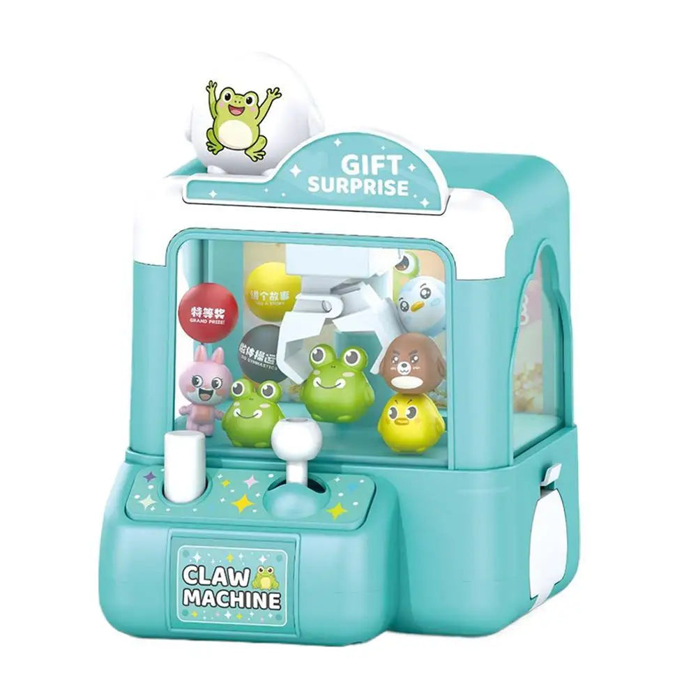 A green and white mini claw machine toy for kids with a clear plastic display box.