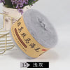 A ball of gray silk mohair blended yarn used for knitting shawls and sweaters.