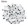 A pile of small white plastic safety eyes for crafting and stuffed animals