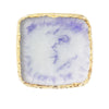 A square resin nail art palette with a white and purple marbled design and a gold trim.