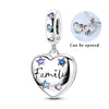 Silver heart pendant charm featuring pink zircon stones and a family inscription