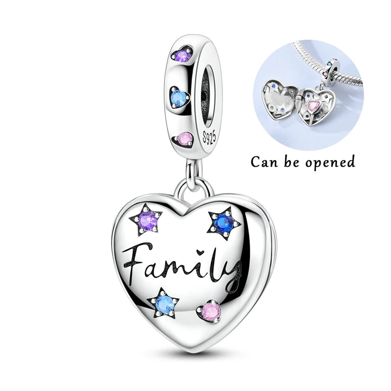 Silver heart pendant charm featuring pink zircon stones and a family inscription